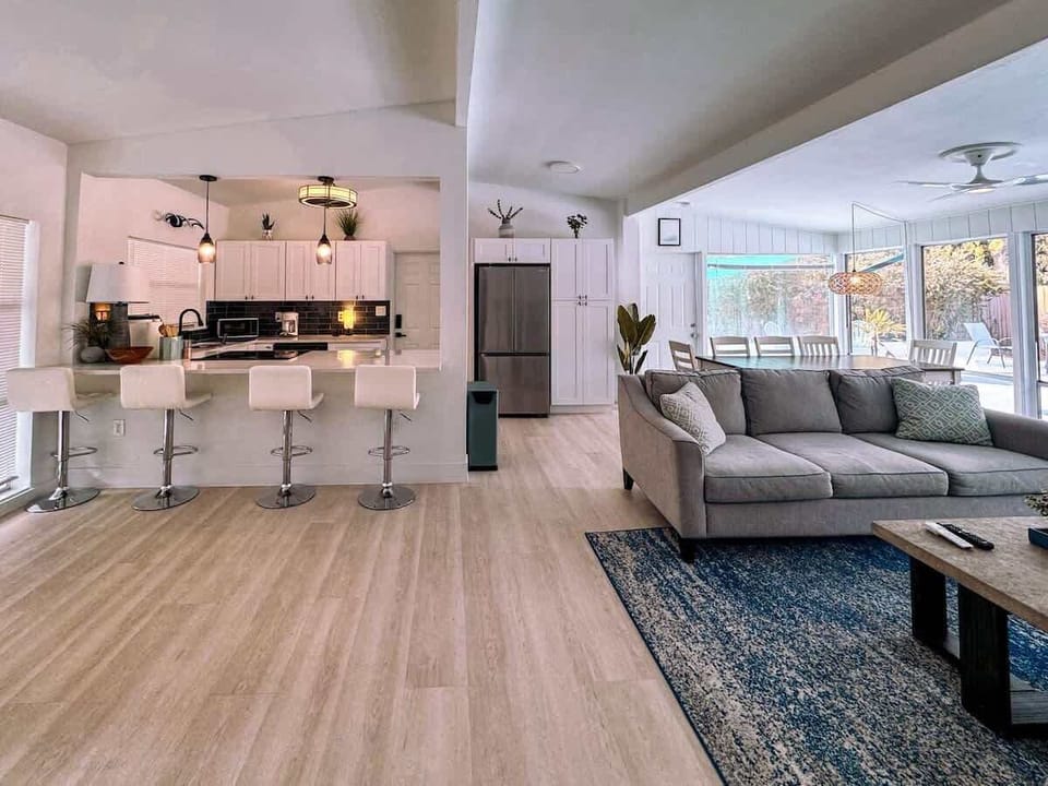 Spacious living room with comfortable sofa where you can watch TV