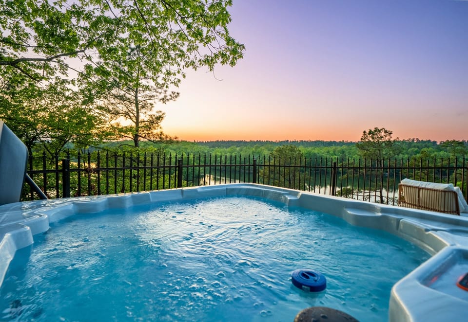 Enjoy a relaxing soak in the Hot Tub overlooking the lake.