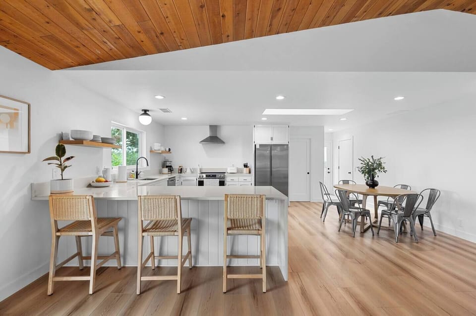 Your gourmet kitchen opens to a bar with seating for the whole family. It’s the perfect spot to gather—whether you're making breakfast, pouring coffee, or sharing a drink.