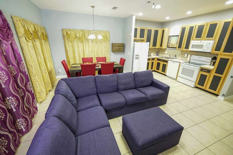 Only beauty, no beast in this comfortable open living room. The couch seats 6 comfortably, and can easily be turned into a cozy movie watching spot with the ottoman.