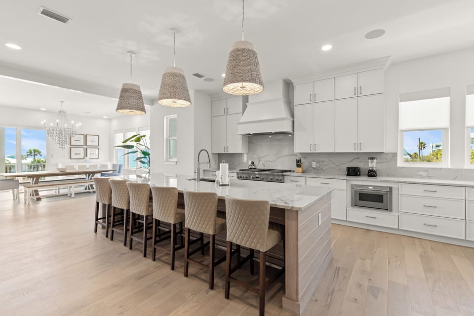 Cook memorable meals in this spacious gourmet kitchen featuring marble countertops, professional appliances, and a large island where you'll gather with loved ones.