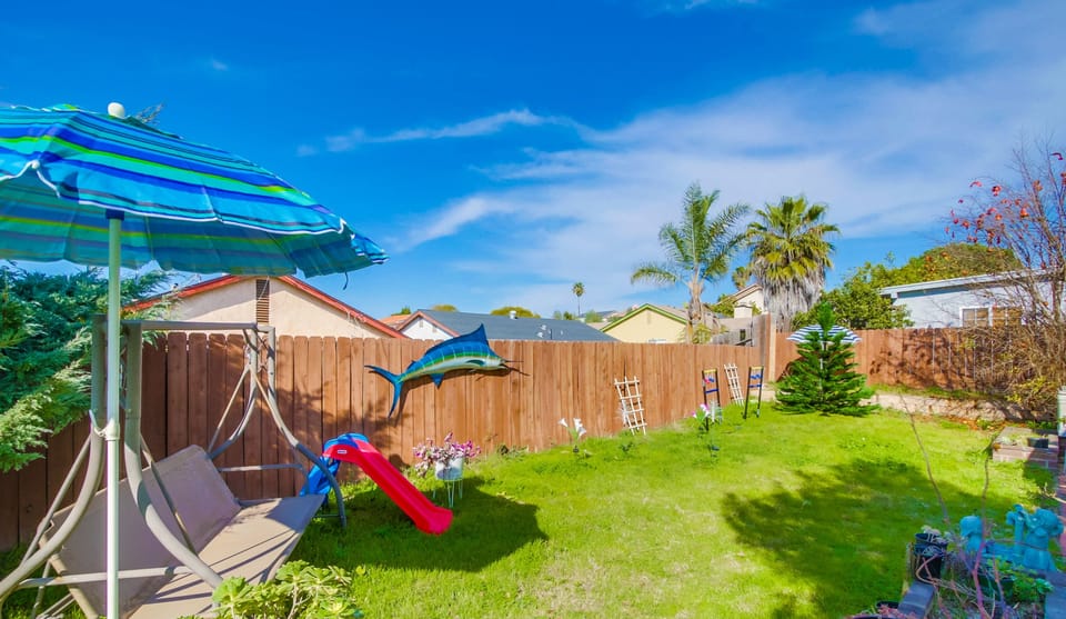 Our backyard features a mini playground that’s a hit with the little ones!