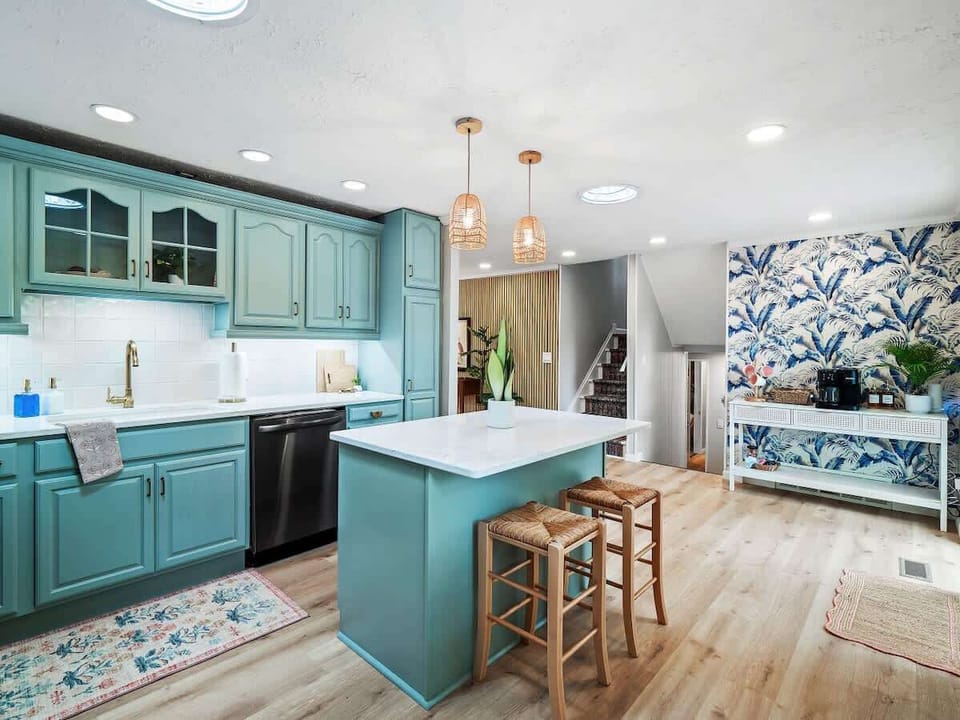 Coastal-inspired kitchen w/ island seating & open layout for easy cooking