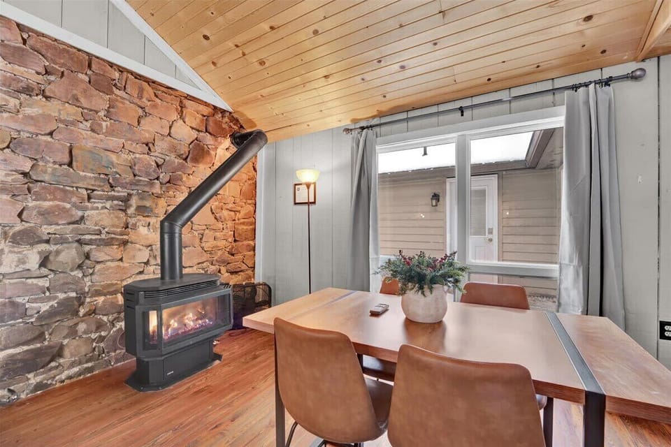 Dining Area with Fireplace and Rustic Stone Accent