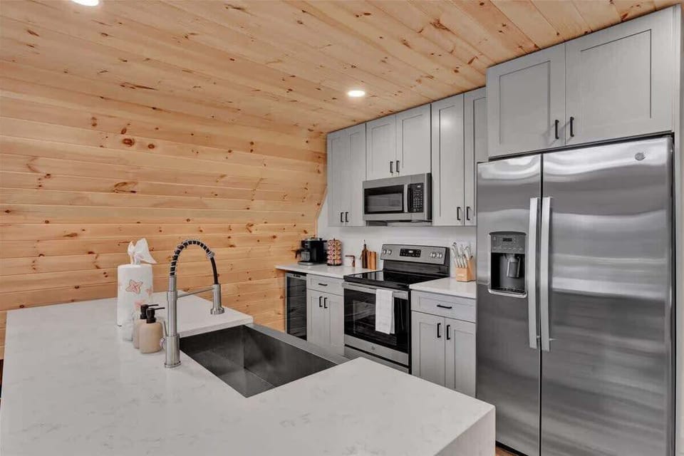 Fully Equipped Kitchen
Modern kitchen stocked for cooking and group meals.
