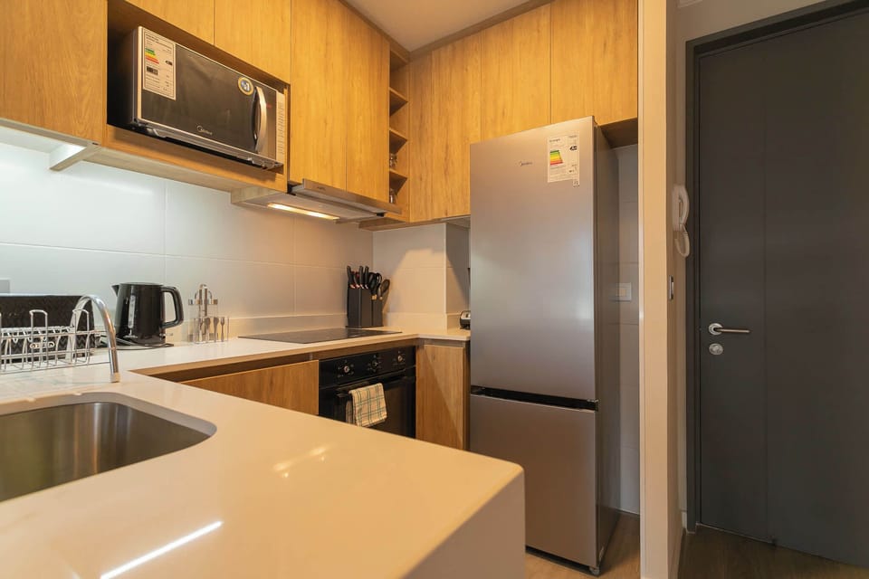 Sleek and modern kitchen with top-notch appliances, perfect for culinary enthusiasts.