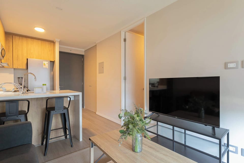 Cozy studio with modern amenities and a sleek kitchen, perfect for a relaxing stay.