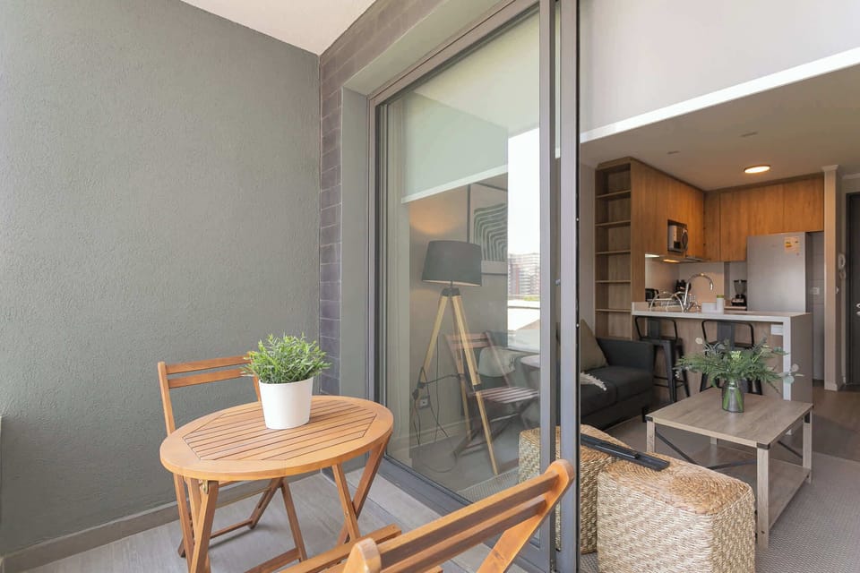 Enjoy breakfast with fresh air on your private balcony, overlooking a stylish interior.