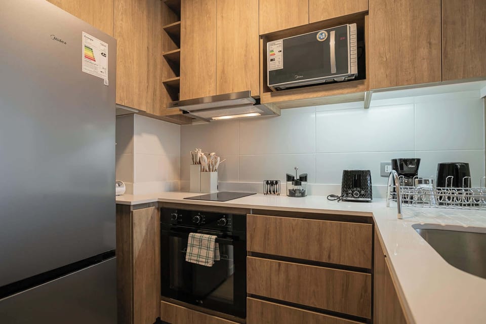 Sleek kitchen with modern appliances and ample counter space, perfect for culinary adventures.