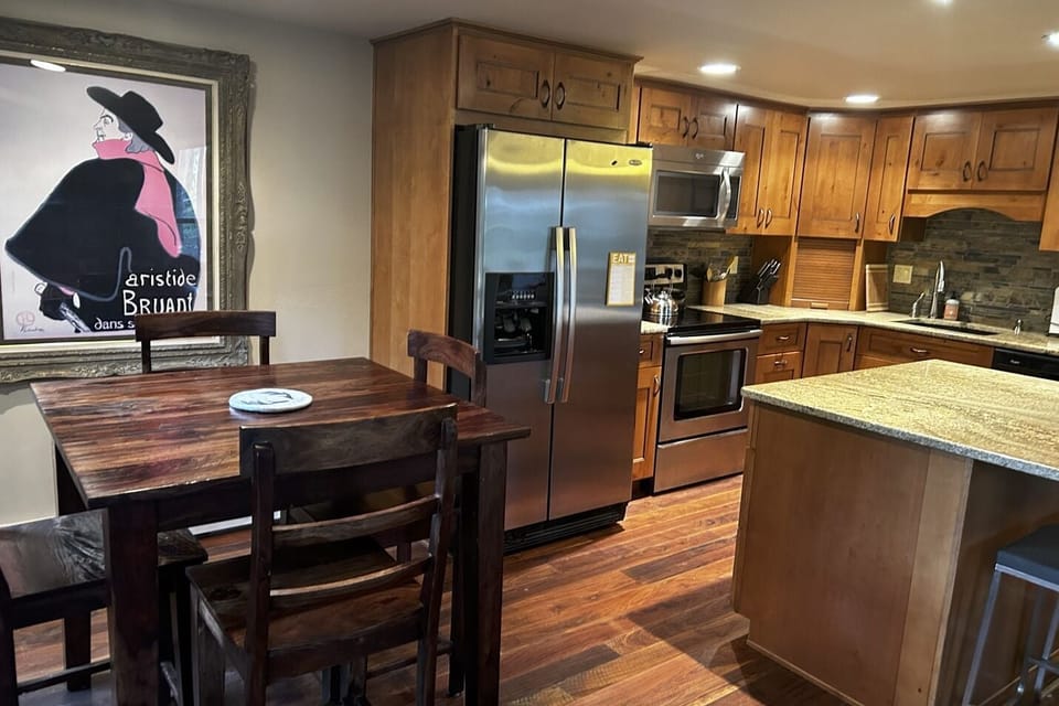 Kitchen is fully stocked with cookware. Seating at kitchen bar, too!
