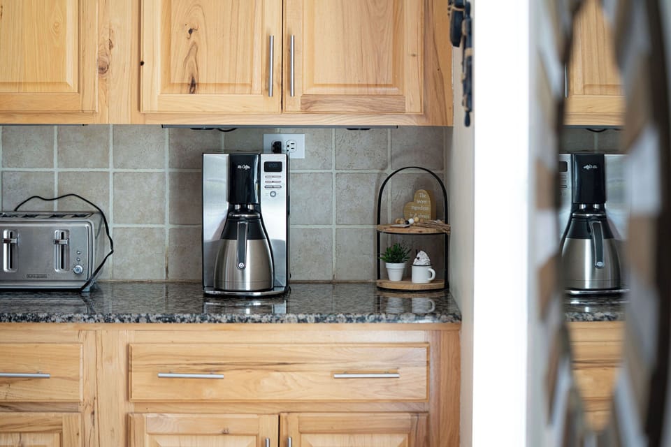 Fully equipped kitchen with modern appliances.