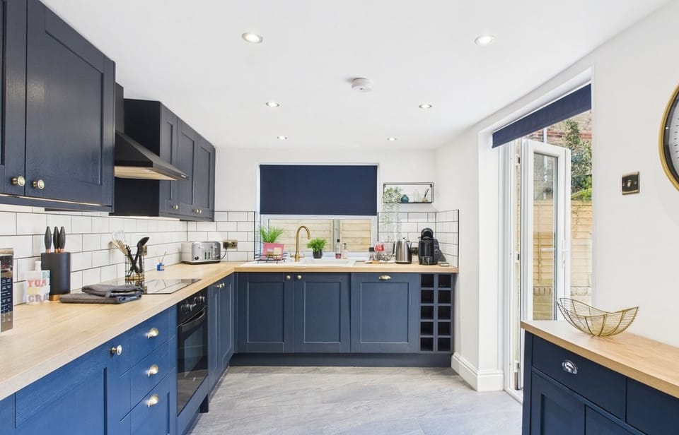 Cook up a feast in the sleek, modern kitchen equipped with an induction hob, oven, and microwave.