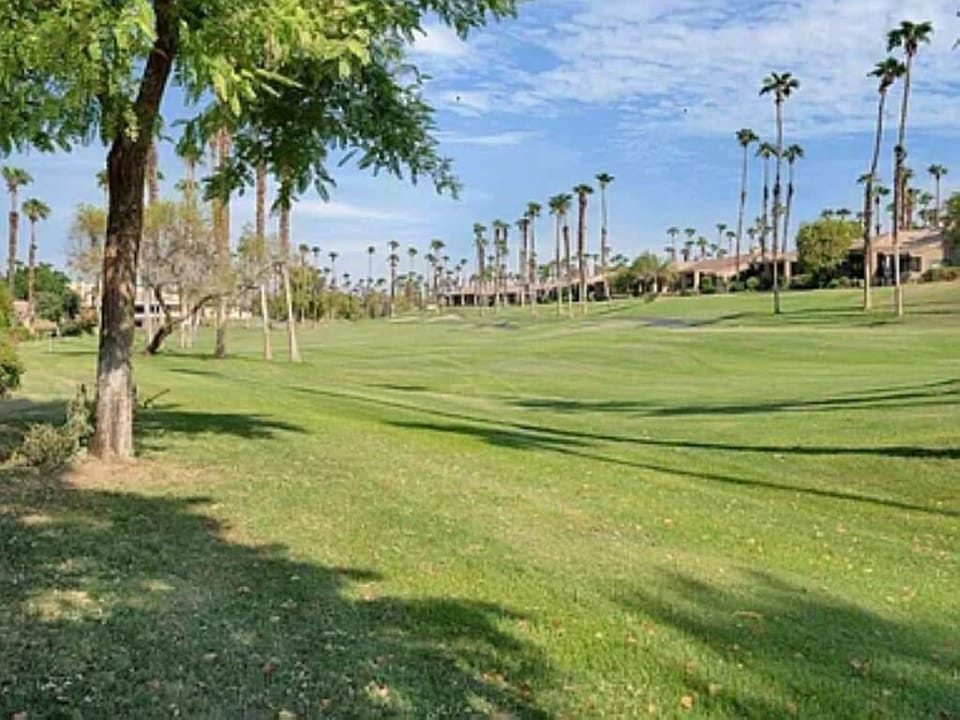View looking down the 9th fairway towards the green and clubhouse.