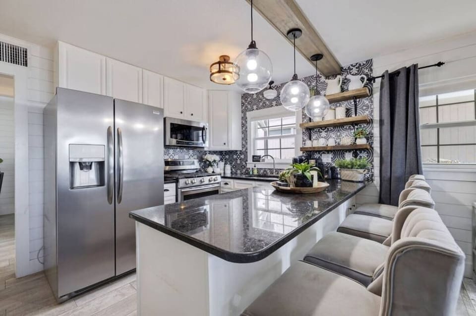 Fully stocked kitchen with everything you need to prepare delicious meals, ensuring your family has everything for a comfortable and enjoyable stay.