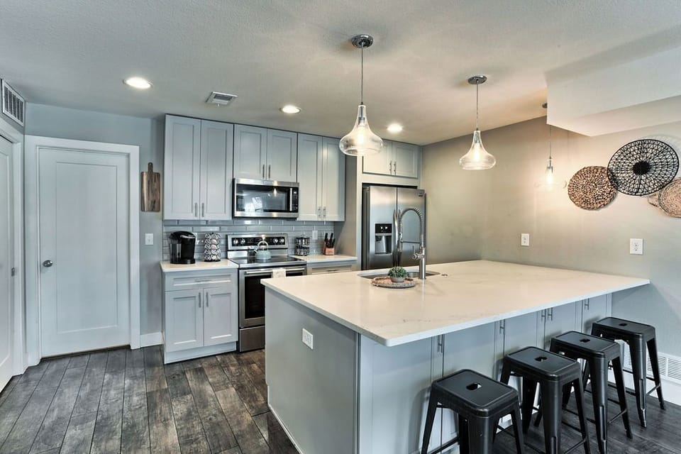 Modern appliances and design highlight the vibrant kitchen