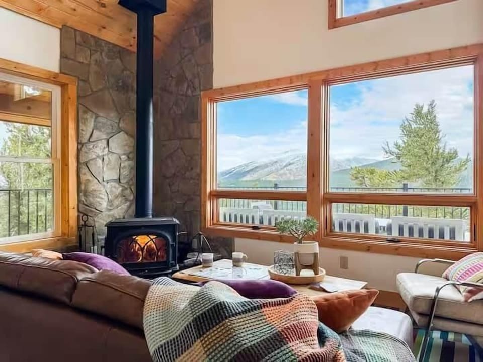 Warm up by the wood-burning fire as you nestle in to enjoy the views.