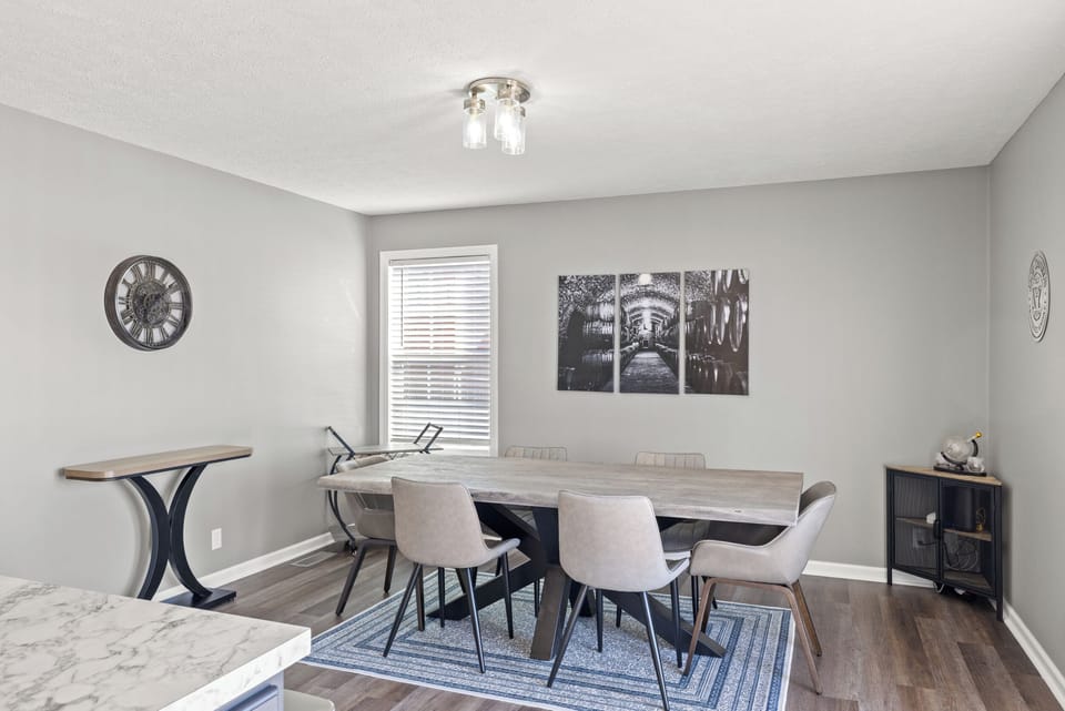 Large dining room table with seating for 6.