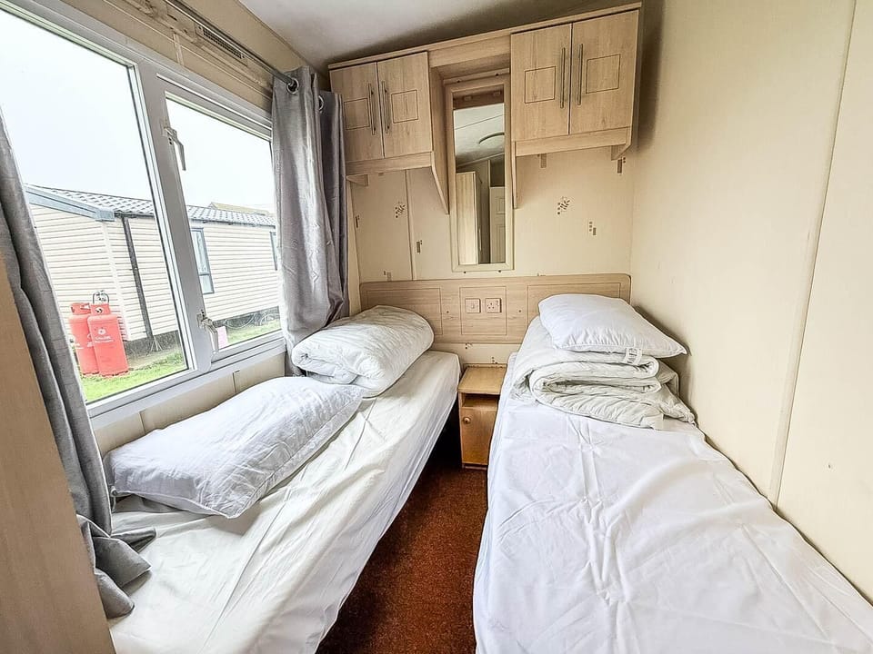Inviting twin single beds, perfect for kids or friends sharing.