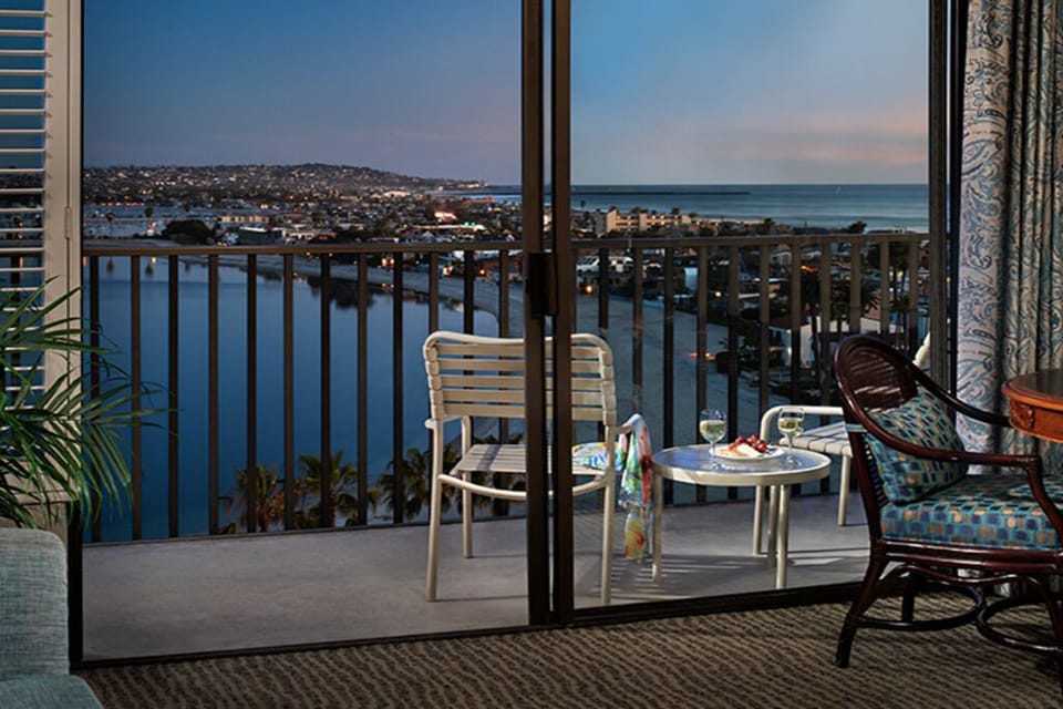 Sip wine on the balcony as city lights sparkle.