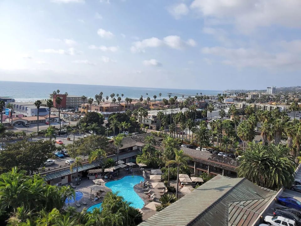 Take in panoramic coastal views over the pool and town.