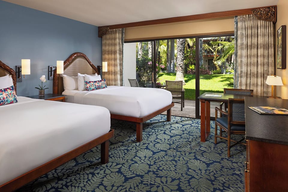 Stretch out on plush beds in a calm, airy room.