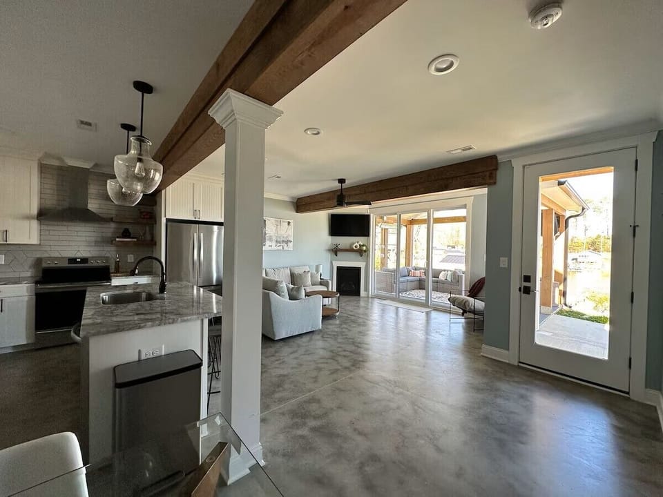 Lower level with kitchen / dining / living / half bath / patio to lake