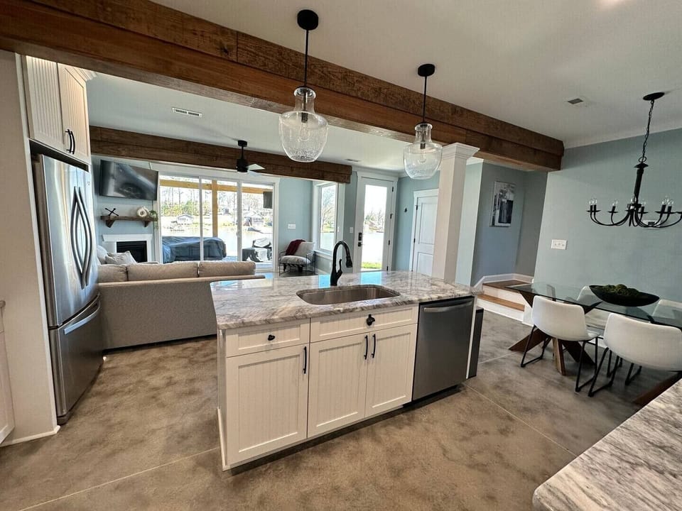 Lower level with kitchen / dining / living / half bath / patio to lake