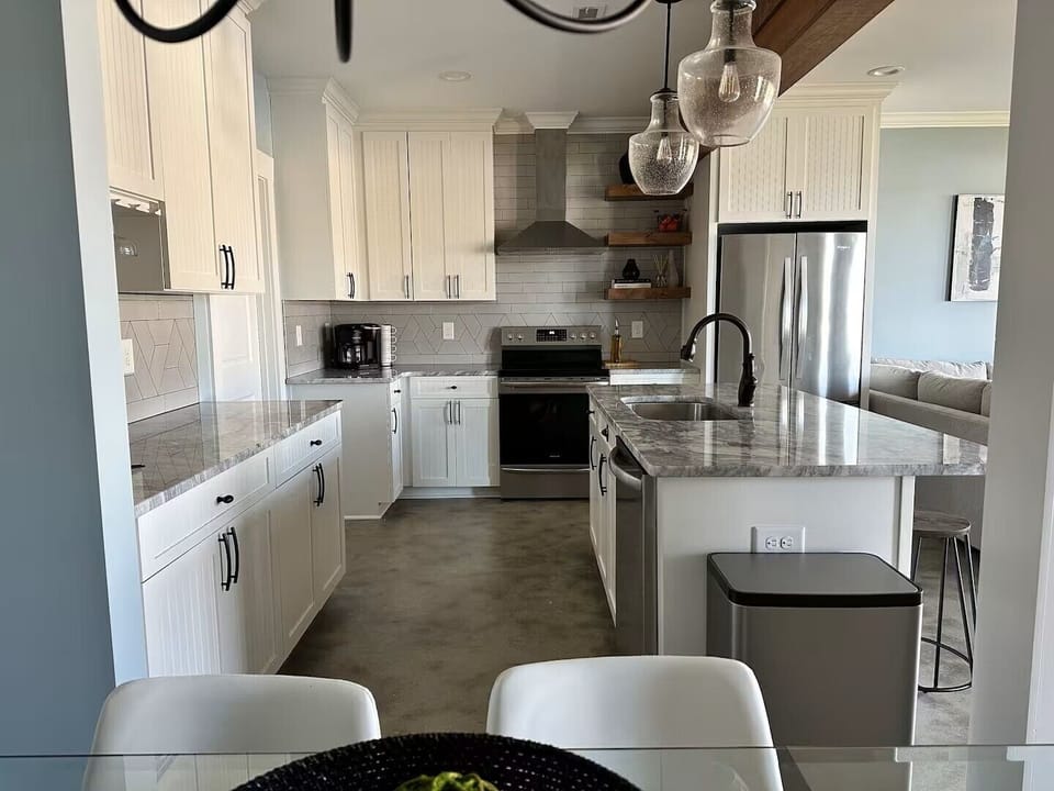 Lower level with kitchen / dining / living / half bath / patio to lake