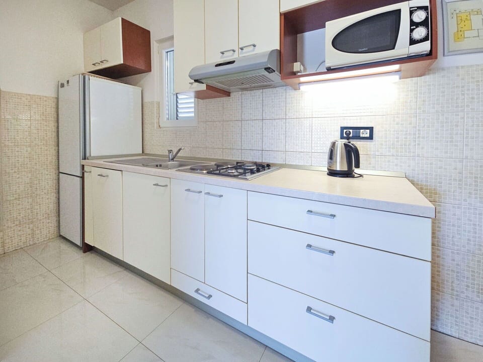 Kitchen, Countertop, Major Appliance, Kitchen Appliance, Flooring, Cabinetry, Kitchen Sink, Interior Design, Floor, Home