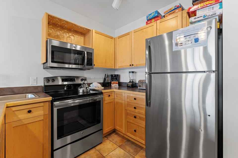Full kitchen featuring stainless steel appliances.