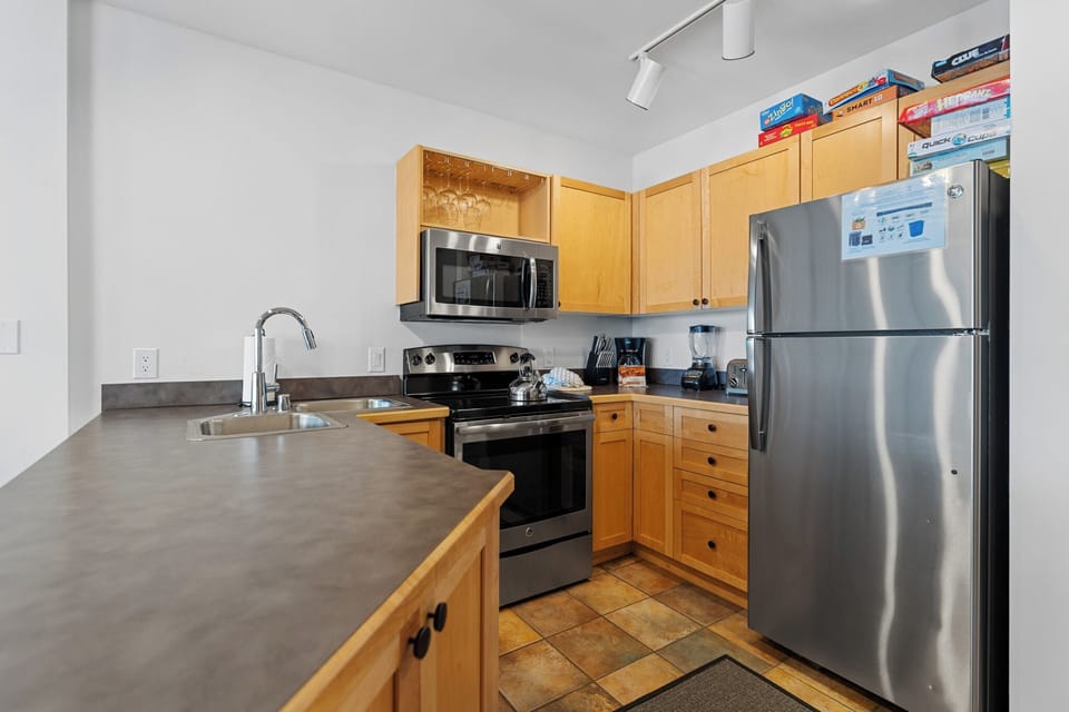 Full kitchen featuring stainless steel appliances.