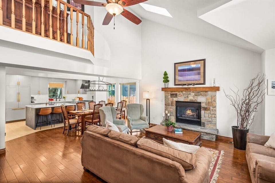 Spacious living room with cathedral ceilings and gas fireplace