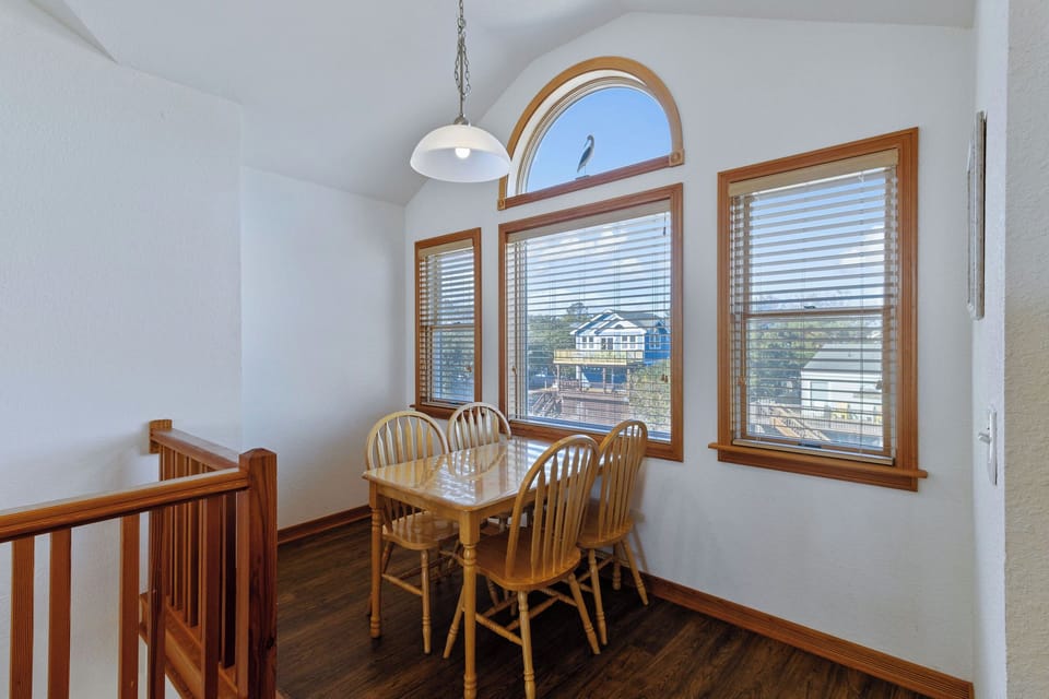 Dining Room - Enjoy a meal, a boardgame, or a little privacy around this smaller dining table overlooking the living space.