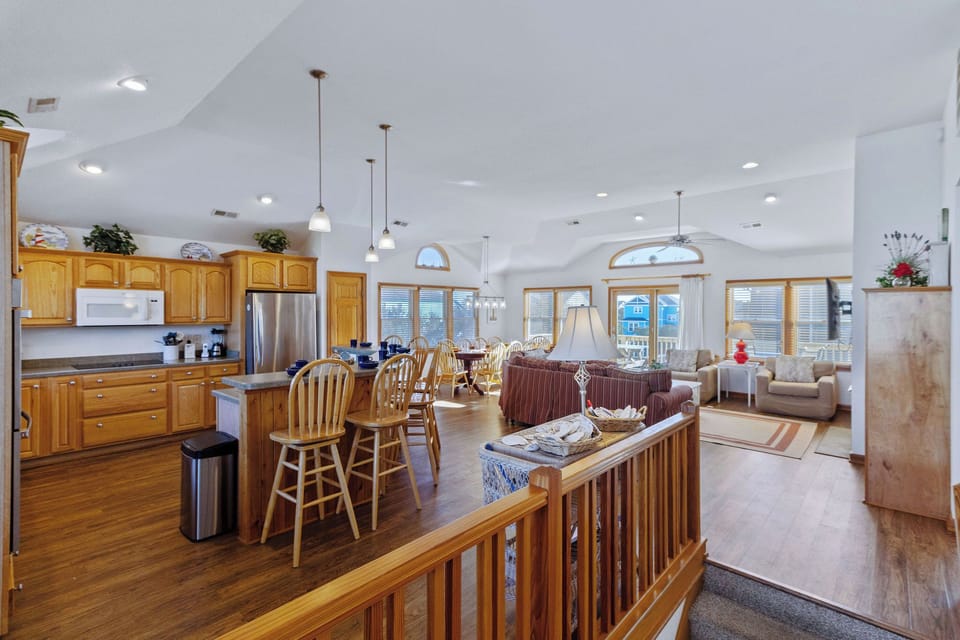 Living Space overlook - Large windows with natural light amplify the high ceilings in the home's open living spaces.