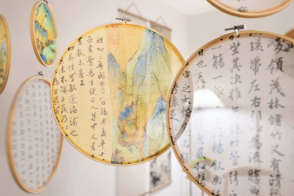 This unique decorative feature showcases intricately designed hanging hoops with beautiful artwork and calligraphy. The delicate details add an artistic and cultural touch, making the space feel both elegant and inspiring.