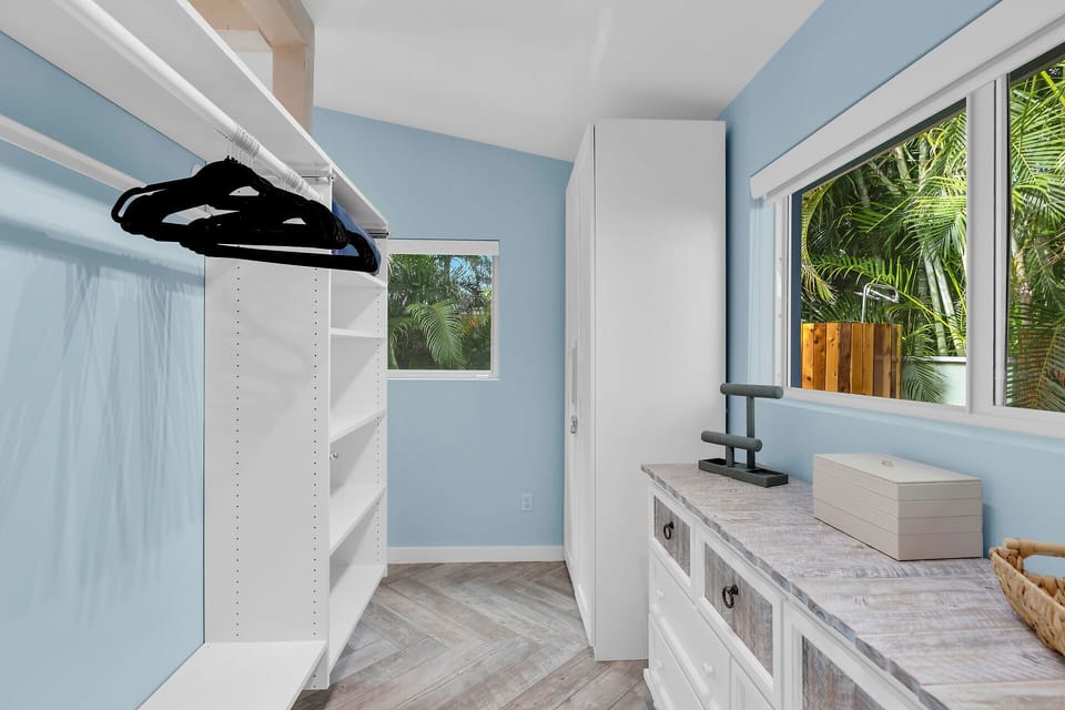 Primary walk in closet with plenty of storage