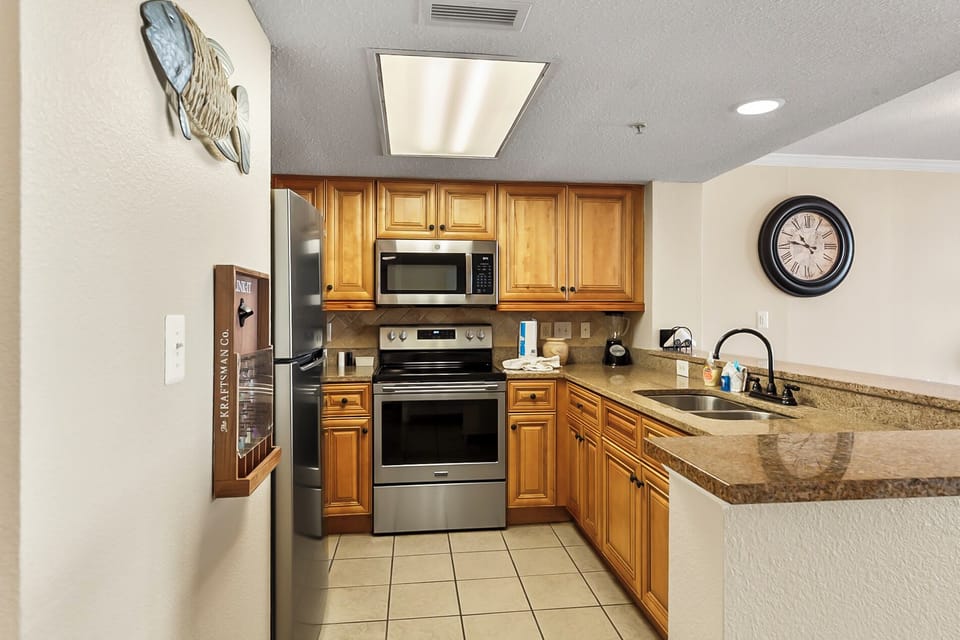 Full-size kitchen equipped with all essentials to prepare daily meals and entertain guests.