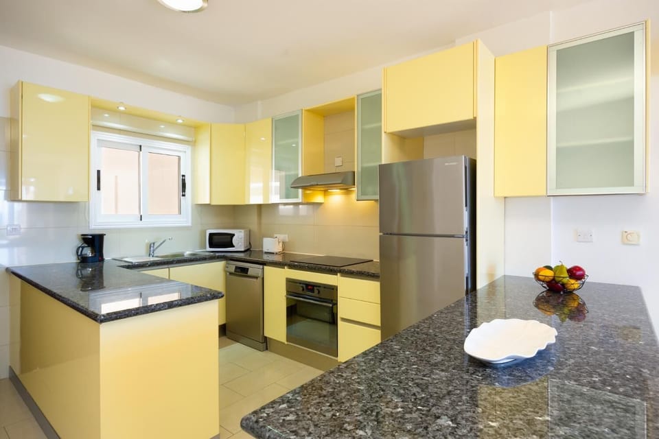 An up-close look inside the fully functional kitchen area, detailing its practical layout and premium finishes.