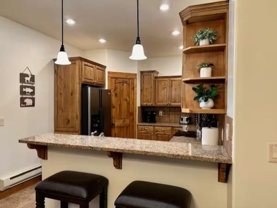 Kitchen with bar stools seating for 2