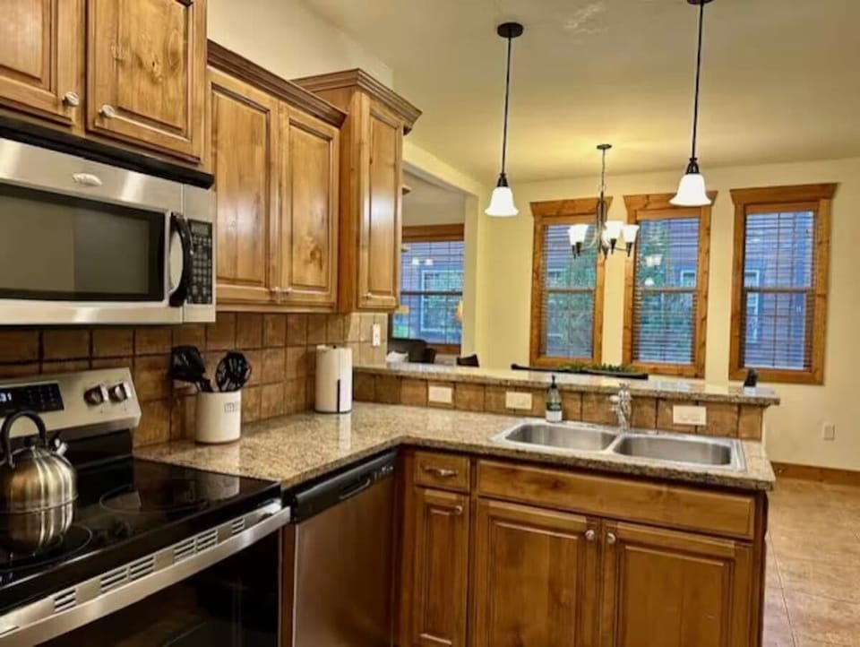 Full kitchen with new appliances: microwave, oven, dishwasher, fridge. 