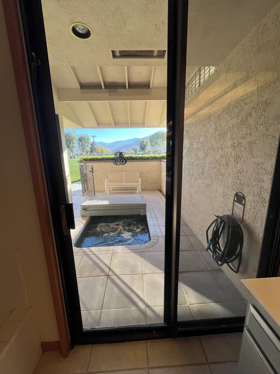 outdoor spa, access from back patio and primary bedroom 1