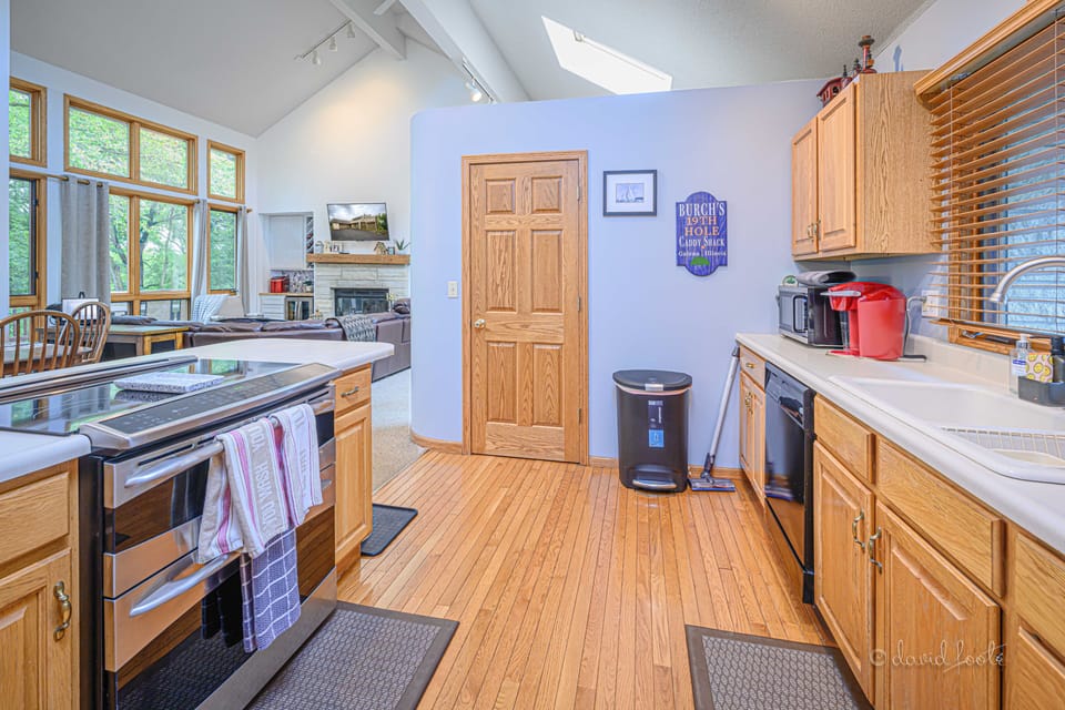 The kitchen is equipped with a dual oven and electric range stove