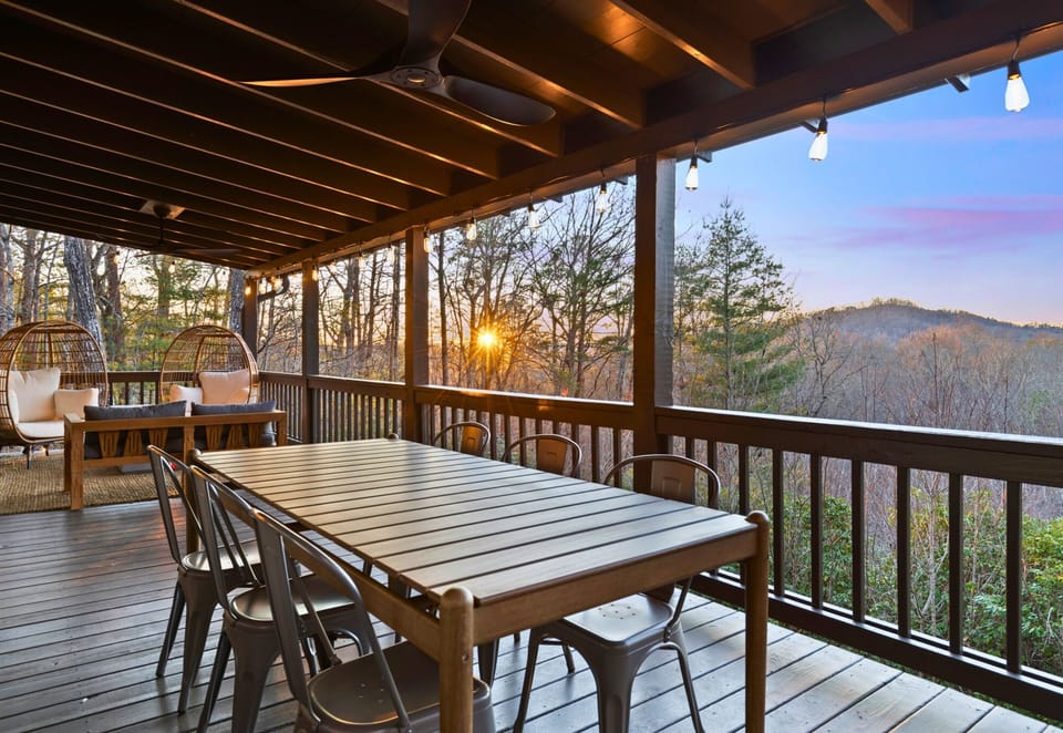 Dine al fresco with a spacious outdoor table and stunning views that make every meal unforgettable.