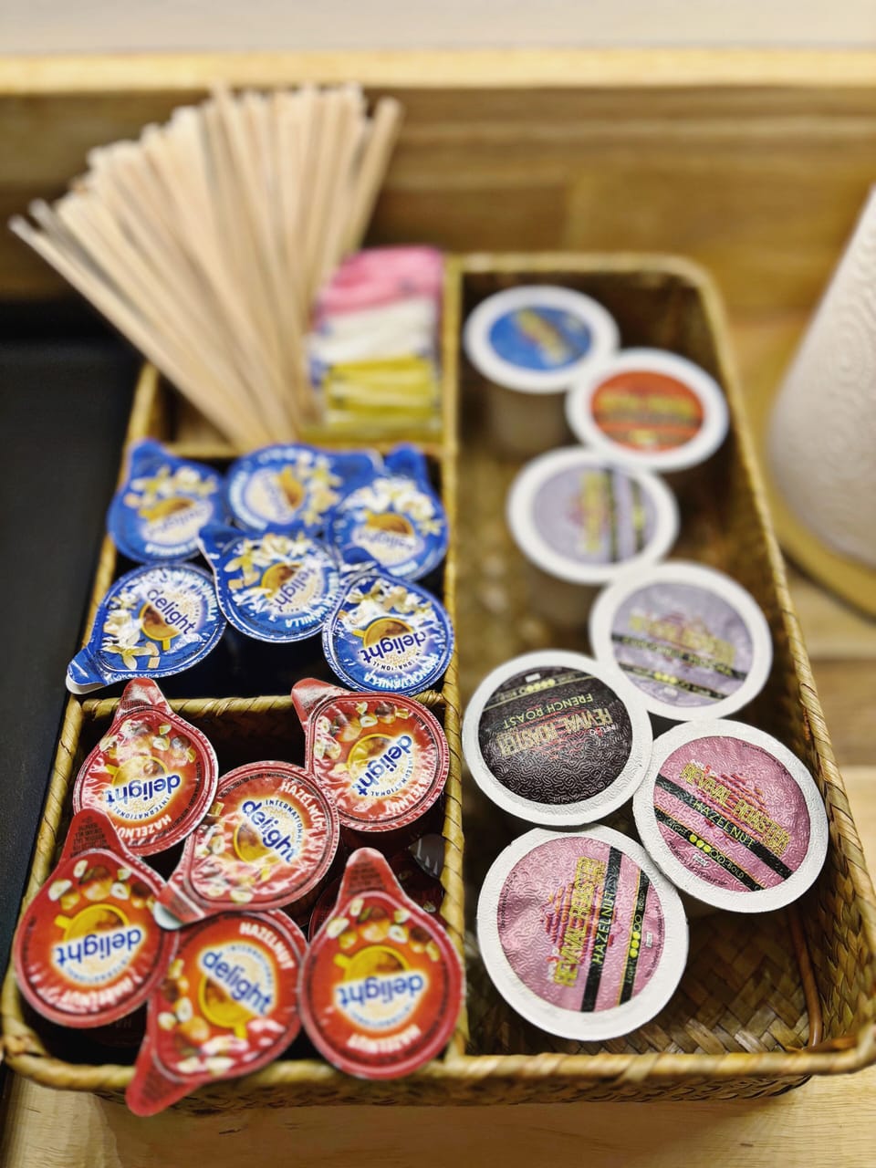 Complimentary K cups, cream and sweeteners with to-go cups/lids