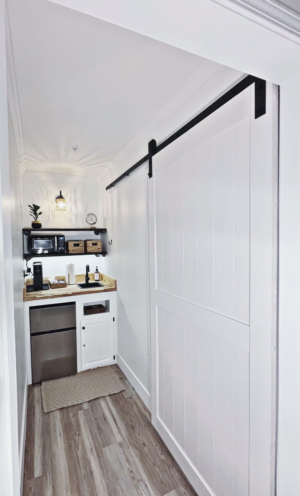 Wet bar features Keurig coffee maker accompanied by a variety of K cup flavors
