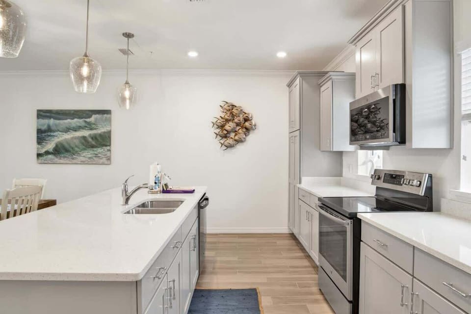 Modern kitchen with stainless steel appliances and a spacious dining area perfect for family meals.