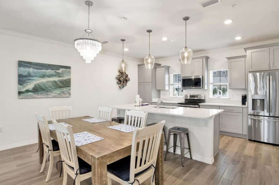 Modern kitchen with stainless steel appliances and a spacious dining area perfect for family meals.