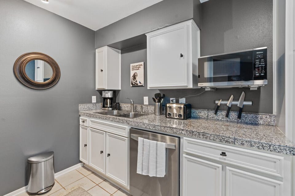 A fully equipped kitchen, complete with modern appliances and ample counter space for cooking.