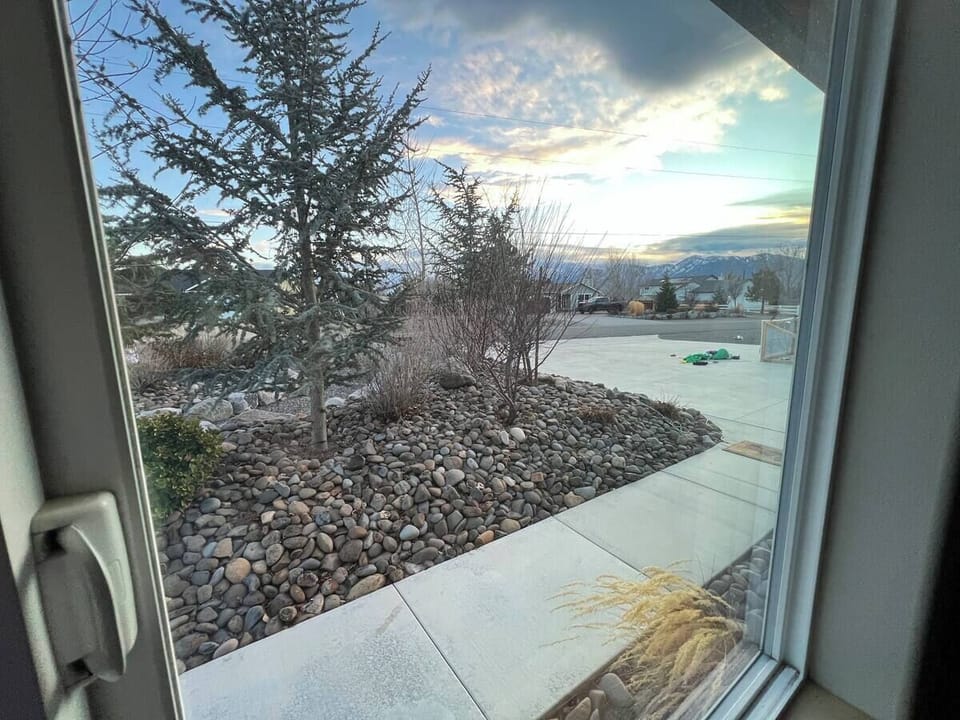 Looking out the living room window at the Driveway and Mountain View.