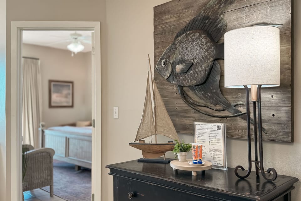 Step into the spacious primary bedroom, conveniently located just off the open concept living area for easy access and comfort